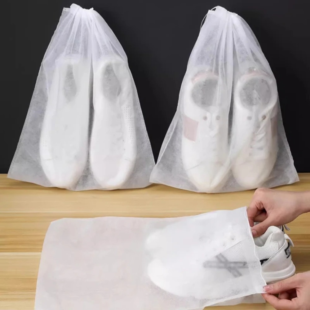Shoe Bag Dust - ถุงคลุมกันฝุ่นแบบระบายอากาศได้ 50 ชิ้น ถุงเก็บของแบบใสพร้อมเชือกรูด ป้องกันฝุ่น ถุงใส่รองเท้าสำหรับเดินทาง